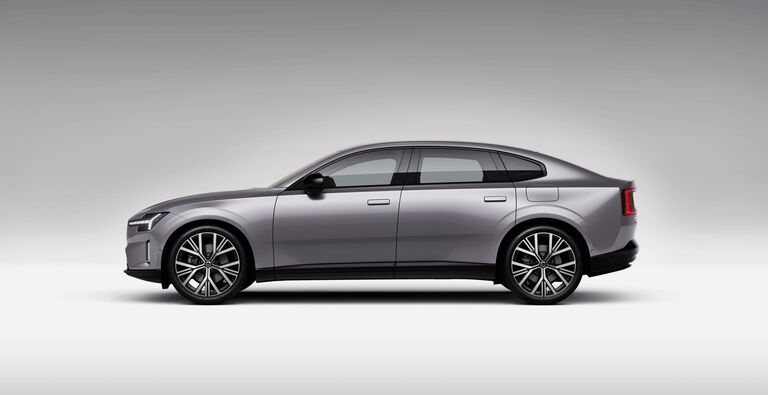 Gray Volvo ES90 car left facing with grey shadow background