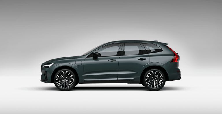 Green Volvo CX60 car left facing with grey shadow background